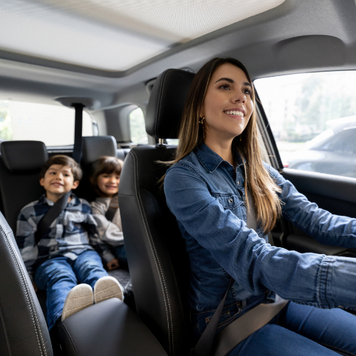 Mom driving with kids in backseat