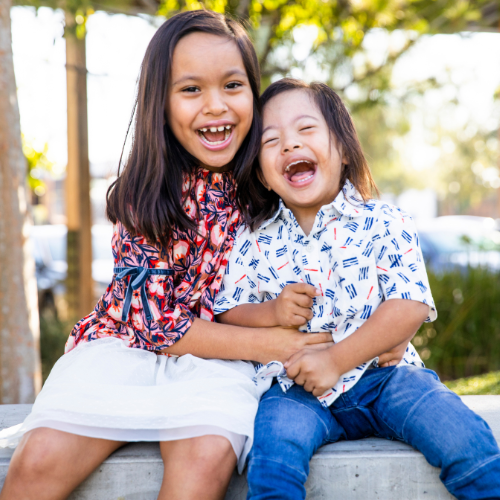 Siblings laughing