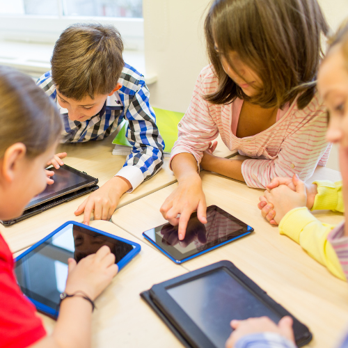 Kids playing on their tablets